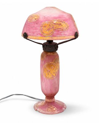 a pink table lamp with a pink shade on it