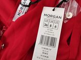 a close up of a red dress with a price tag on it
