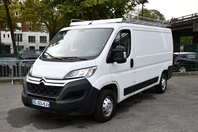 a white van that is parked in a parking lot