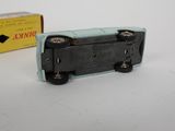 a small toy train that is sitting next to a box
