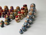 a lot of russian nesting dolls on a white surface