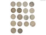 a lot of coins that are on a white surface