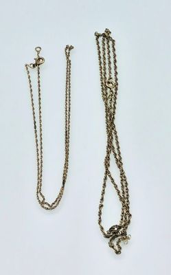 three different types of necklaces on a white surface