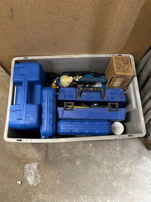 a blue tool box with tools inside of it