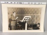 a picture of a man that is playing a piano