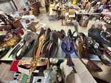 many pairs of shoes that are sitting on a table