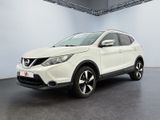 the white nissan qx - v is parked in a large room