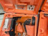two tools in the orange case on the floor