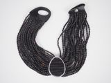 black braided hair with a metal clasp on a white background