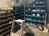 a ladder in the middle of a room filled with tools