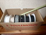 a box with a bunch of different types of thread in it