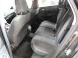 the back seats of a car are empty in a parking lot