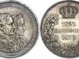 a close up of a coin with a crown on top of it
