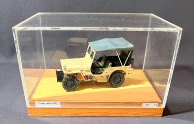 a small model of a military vehicle in a display case