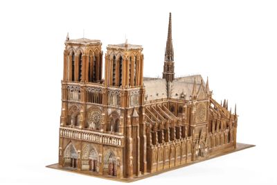 a wooden model of a cathedral on a white surface