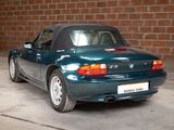 a blue sports car parked in a garage
