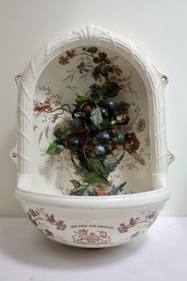 a white bowl with a bunch of berries in it