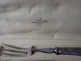 a knife and fork in a case on a table