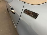 a sticker on the door handle of a car
