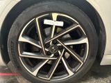 a close up of a tire on a white car