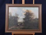 painting on easel of a painting of horses in a wooded landscape