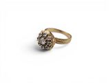 a close up of a gold ring with diamonds on it