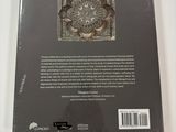 the back cover of a book with a picture of a flower on it
