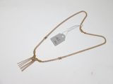 a close up of a necklace with a tag attached to it