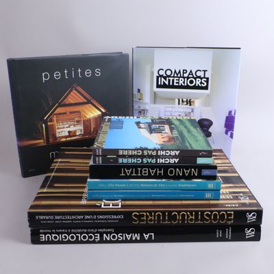 several books are stacked on top of each other on a table
