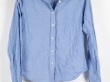 the shirt is blue and white with a white collar
