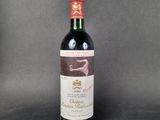 a bottle of wine that is sitting on a table