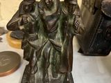 a bronze figurine of a group of people