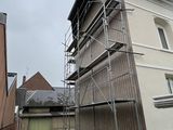 a tall building with scaffolding on the side of it