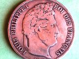 a close up of a coin on a green surface