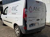 a van that is parked in front of a building