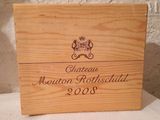 a wooden box that has a wine label on it