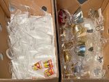 two boxes filled with different types of items in them