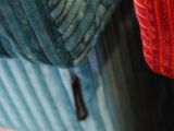 a close up of a person ' s hand holding a piece of luggage