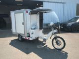 a small motorcycle with a trailer attached to it