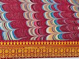 a close up of a table with a red table cloth on it