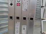 a metal rack with stickers on it in a warehouse