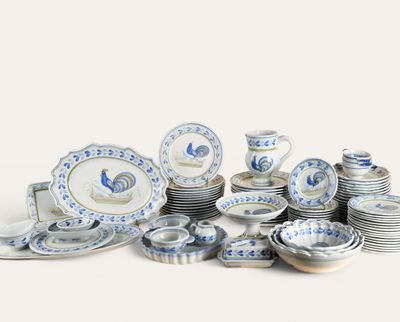 a pile of blue and white plates and bowls