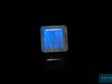 an image of a square blue stone with a black background