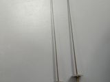 three metal swords on a white surface with a white background