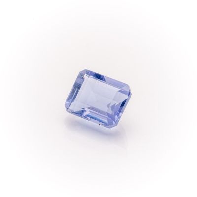 a blue sapphire stone on a white background