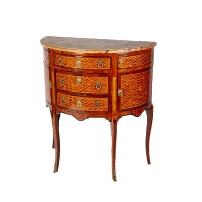 an image of a small wooden chest of drawers