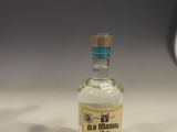 a small bottle of alcohol sitting on a table