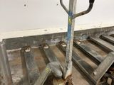 a dolly with a handle and a hand truck with wheels