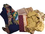 a pile of clothing that is laying on the ground