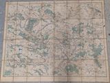 a map on the floor with a blue marker on it